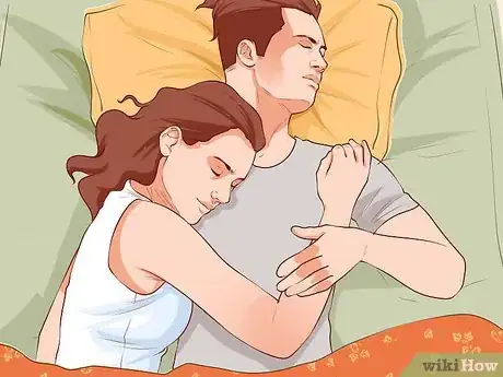 Image titled Avoid Trapping Your Arm While Snuggling in Bed Step 9