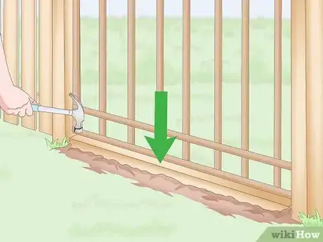 Image titled Stop a Dog from Digging Under the Fence Step 1