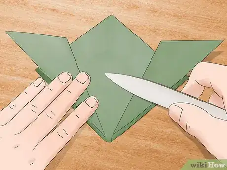 Image titled Use a Bone Folder Step 7