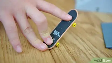 Image titled Ollie on a Tech Deck Using Three Fingers Step 4