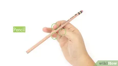 Image titled Spin a Pencil Around Your Thumb Step 1