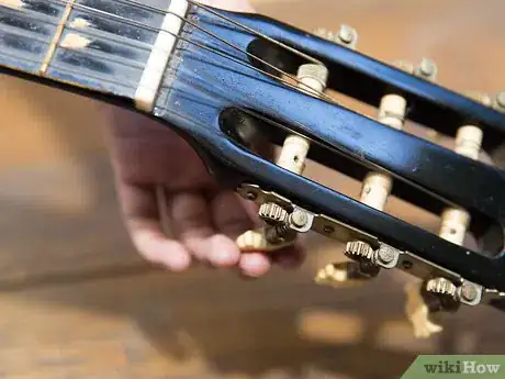 Image titled Change Strings on an Acoustic Guitar Step 3