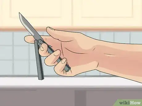 Image titled Perform a Trebuchet with a Butterfly Knife Step 5