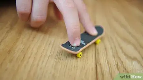 Image titled Ollie on a Tech Deck Using Three Fingers Step 2