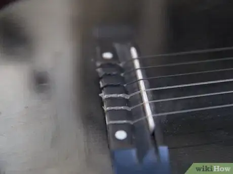 Image titled Change Strings on an Acoustic Guitar Step 1