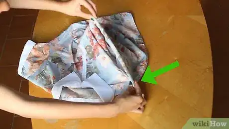 Image titled Fold a T‐Shirt in Two Seconds Step 6