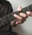 Play Barre Chords on a Guitar