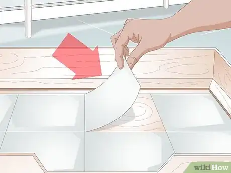 Image titled Keep a Whelping Box Clean Step 1