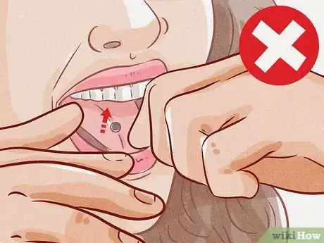 Image titled Brush Your Teeth with a Tongue Piercing Step 1