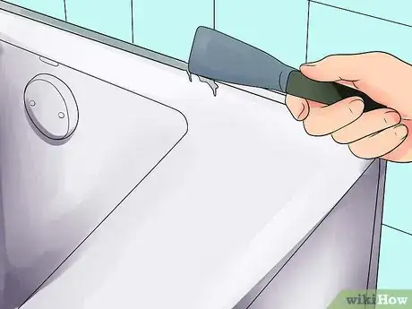 Image titled Seal Around a Basin or Bathtub with Silicone Step 1