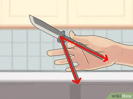 Image titled Perform a Trebuchet with a Butterfly Knife Step 8