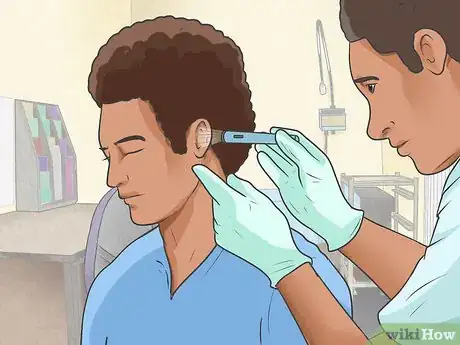 Image titled Remove Wet Wax from Infected Ears Step 1