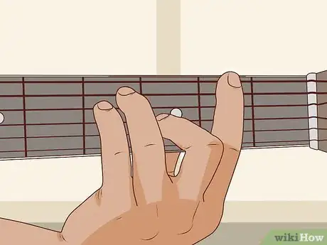 Image titled Play Guitar Faster Step 1