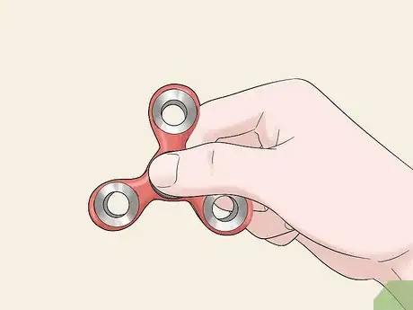 Image titled Do Fidget Spinner Tricks Step 1