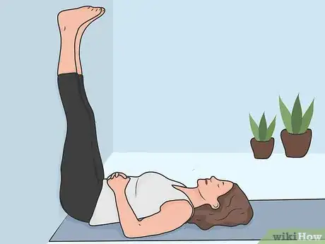 Image titled Stretch Your Lower Back While Lying Down Step 01