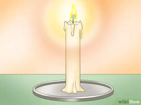 Image titled Put Out a Candle with Your Fingers Step 1