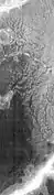Channels West of Echus Chasma.  The fine pattern of branching stream beds were probably formed from water moving across the surface.