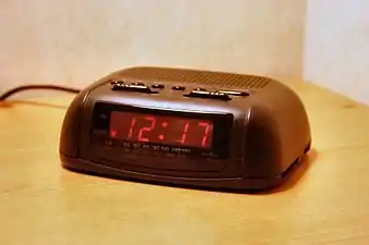 A basic digital clock radio with analog tuning