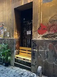 Improvised street bench in Naples (Italy), made from wooden pallet