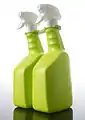 Clip used to join two spray bottles and provide a handle