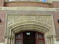 Stone-carved name above main entrance