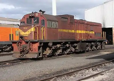 No. 35-467 in SAR Gulf Red and yellow whiskers livery, Bellville loco depot, Cape Town, 24 May 2009