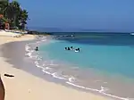 Saud Beach near Apo Idon resort. The Northwind Power windmills in neighboring Bangui can be seen in the distance.