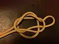 8-4-The remaining slip is passed over the loop and under the knot bight  pulled through the loop