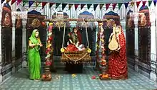 Moving statues inside Manas Bhavan at Tulsi Peeth