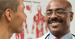 	photo of a doctor talking to a patient
