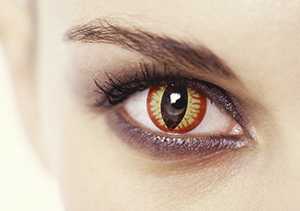 A woman wearing a decorative contact lens that resembles a cats eye