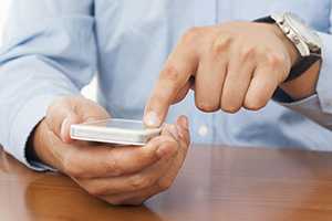 Person using their smartphone.