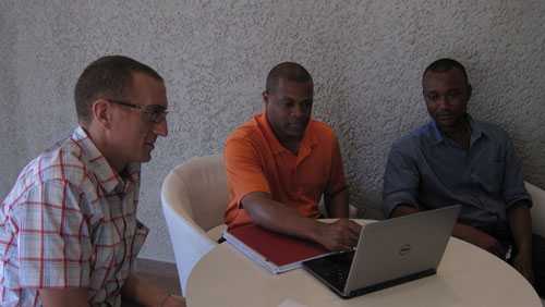 George Fergeson (BBC Media Action SL Country Director), Patrick Minor, CDC Sierra Leone DART liaison, and Musa Sangarie, Program Manager (BBC Media Action)