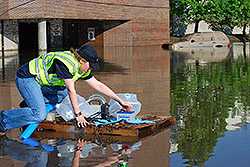 Ellen Yard, PhD (EIS 09) checking water quality during flood in Tennessee