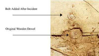 image showing the
original wooden dowel and the bolt added after the incident