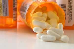 prescription drug bottle with drugs