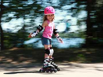 photo: girl skater wearing protective gear
