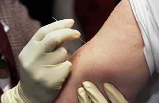 Clinician demonstrates the proper way to administer the smallpox vaccine using a bifurcated needle. Source: CDC/James Gathany.