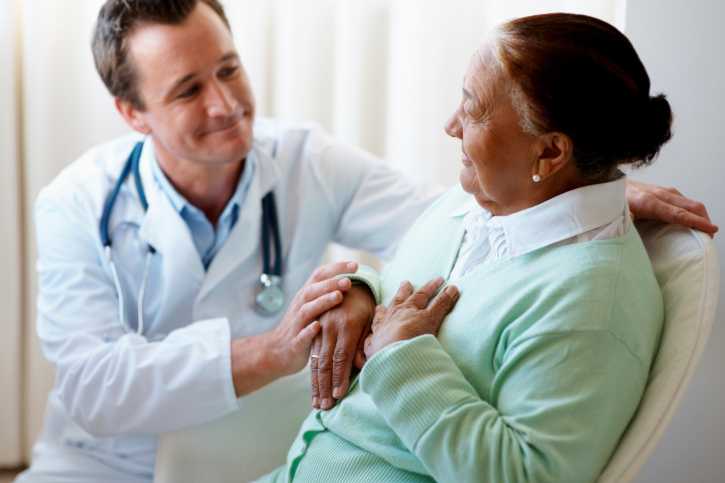 A woman speaking with her health care provider. A woman speaking with her health care provider.