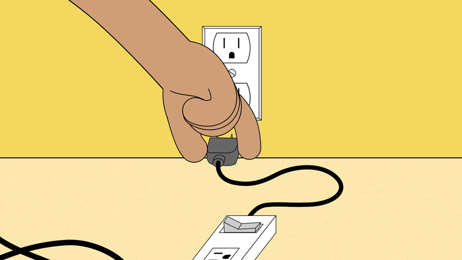 plugging the surge protector into the wall plugging the surge protector into the wall